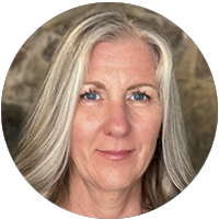 A round head-shot of Michele Lorraine